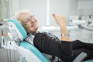 senior woman sitting in dentist chair