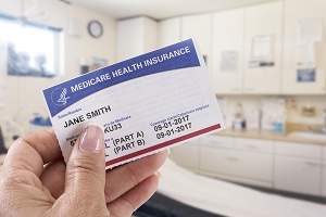 woman holding medicare card