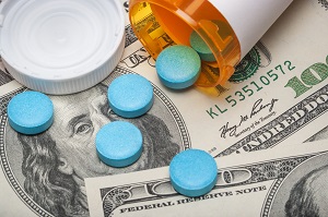 prescription pills spilled over on money